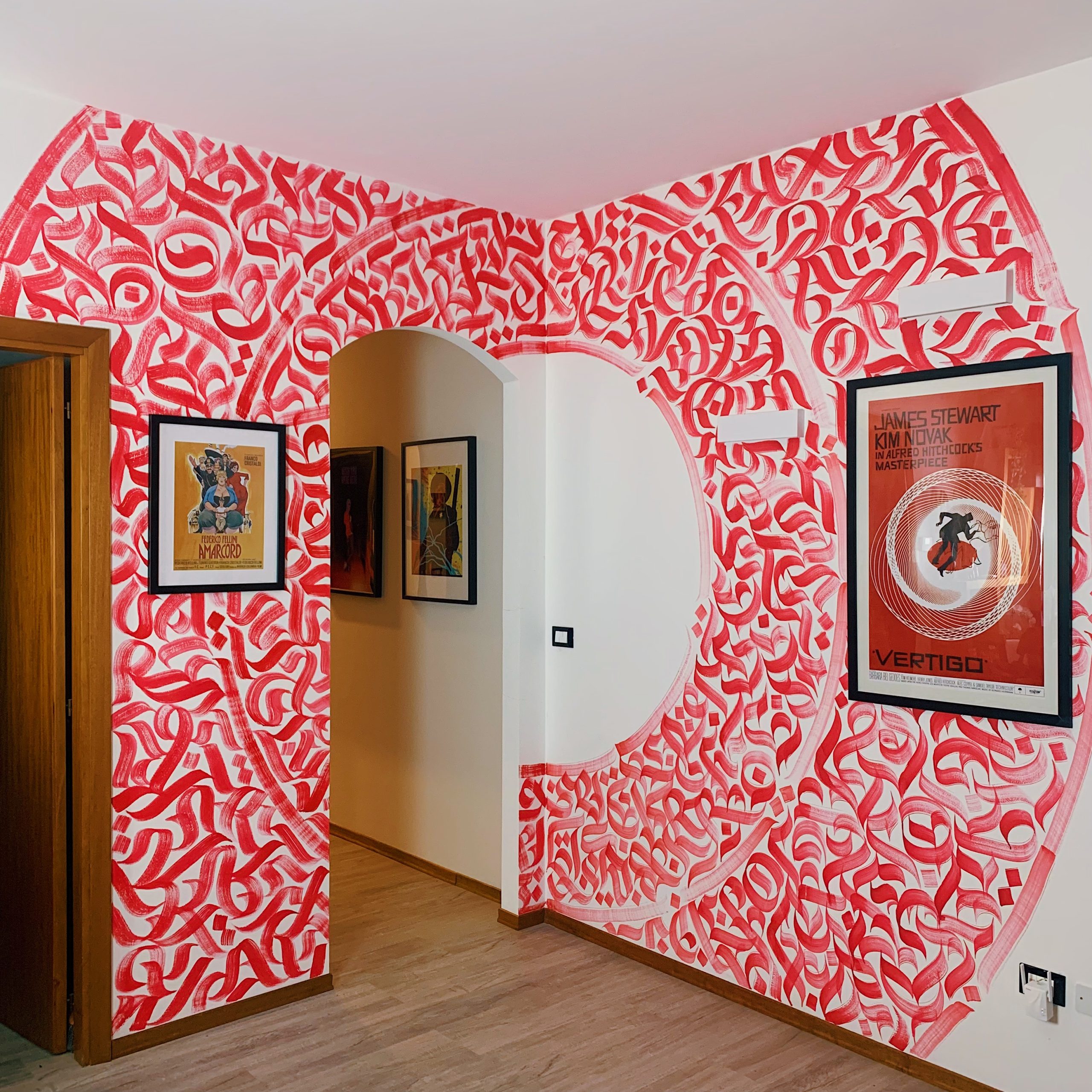 Shot of a part of the mural, at the corner of the living room of the private space, with the lights off. 