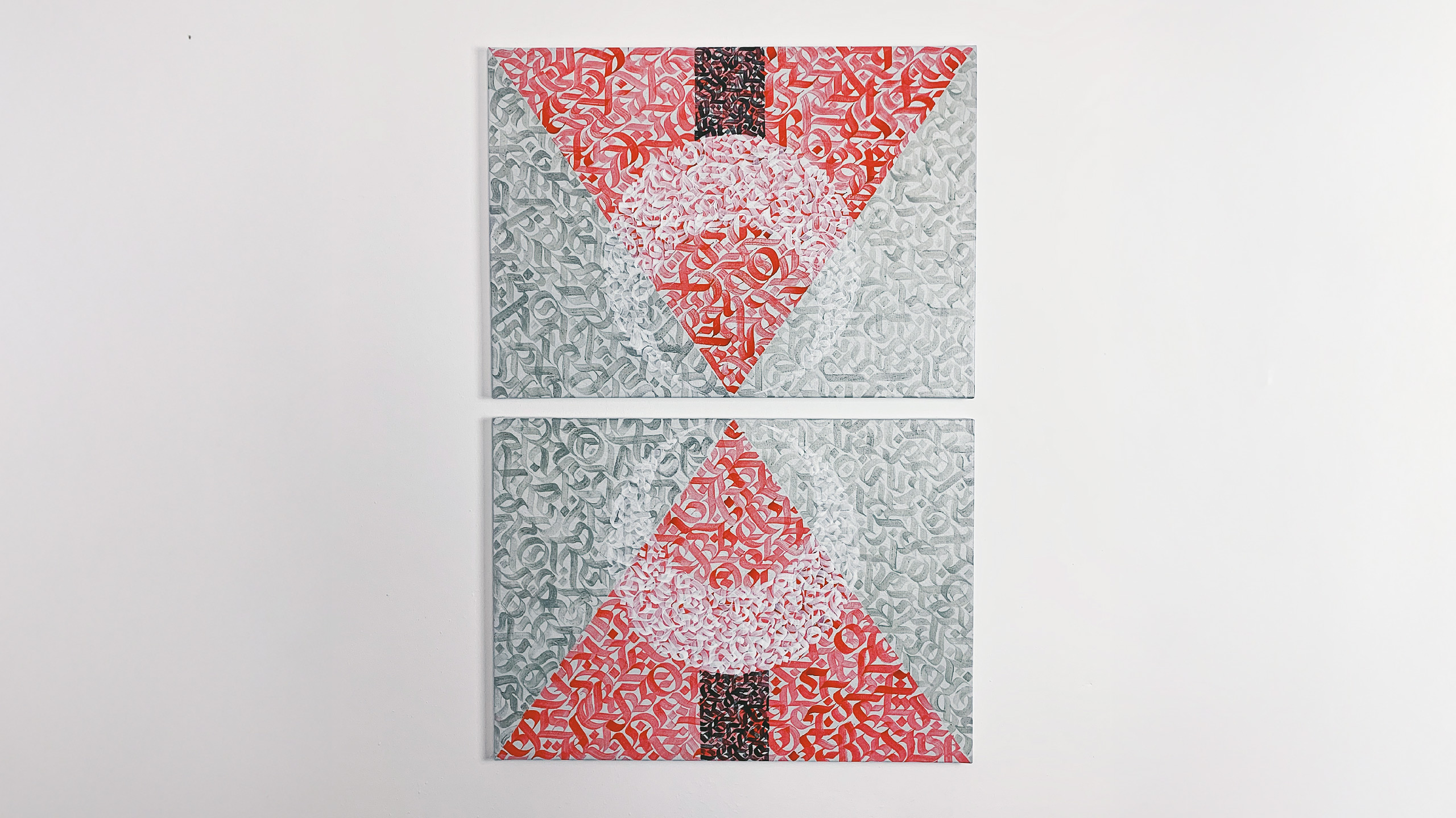 A shot of a canvas artwork made in the living room. Abstract calligraphy within geometric shapes divided into two 50x70 canvases painted with acrylic paint.